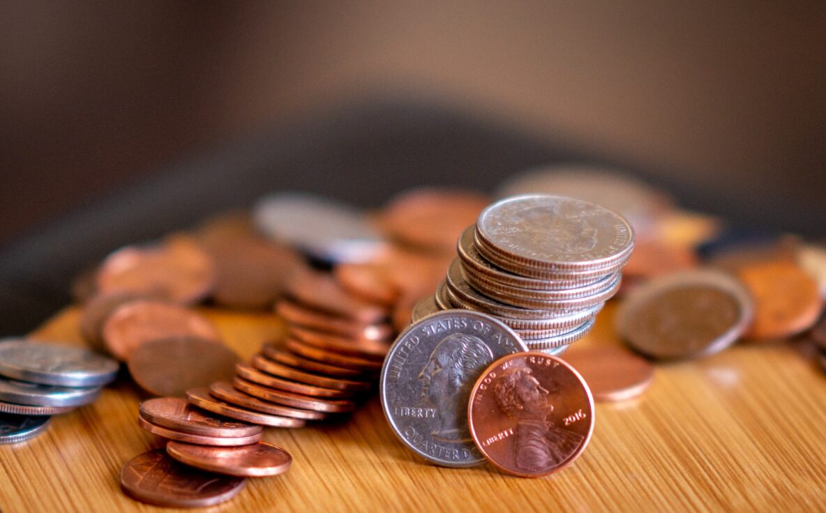 piles of coins for IRS Announces Increased Mileage Rates blog post